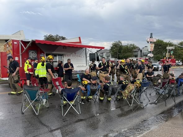 Dallas firefighters resting and refueling at the department&rsquo;s emergency rehab canteen