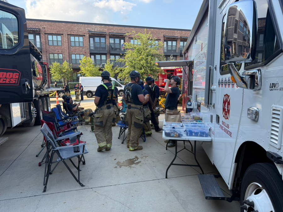 Dallas firefighters refueling at a Box4 rehab station on scene